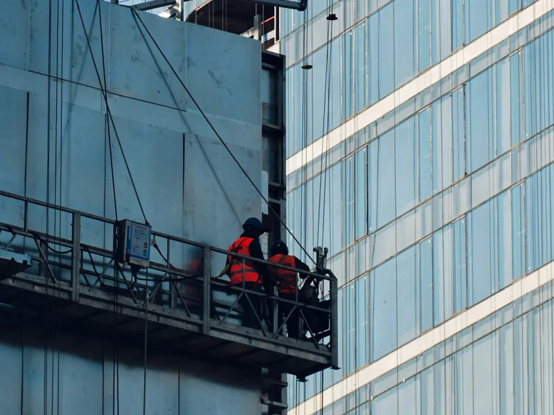 Barakah Trading & Consultancy team on-site during a glass installation in Dhaka